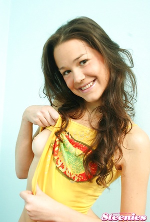 Playful brunette teenie undressing and teasing