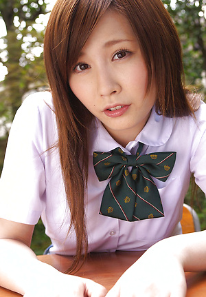 Schoolgirl Iyo Hanak poses at the open air in sexy skirt