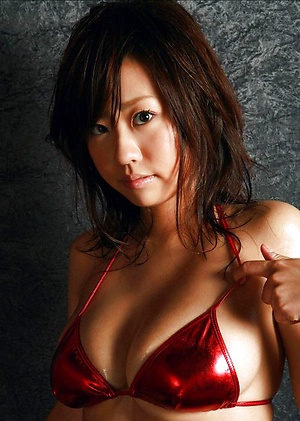 Beautiful gravure idols pink bikini can barely hold her big tits