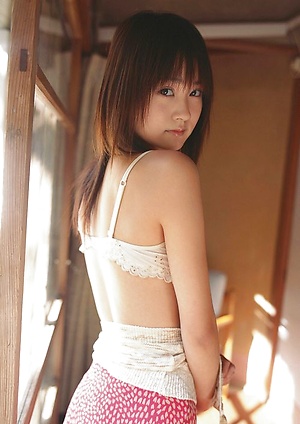 Sexy gravure idol in stripped black and white stockings