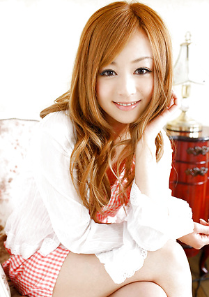 Beautiful gravure idol angel in a cute short dress and boots