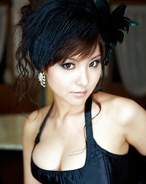 Gorgeous gravure idol can barely keep her tits in her lingerie