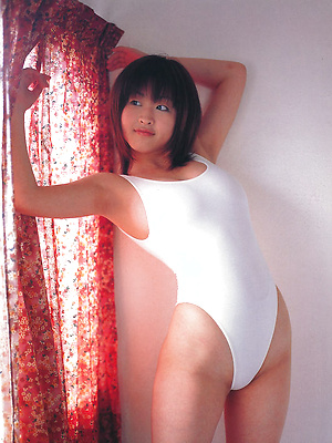 Seductive asian hottie exhibits her big juicey boobs in a bikini