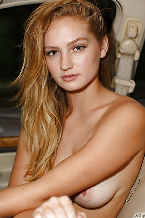 Blonde American Ellen Kennedy strips outdoors and displays her juicy boobs